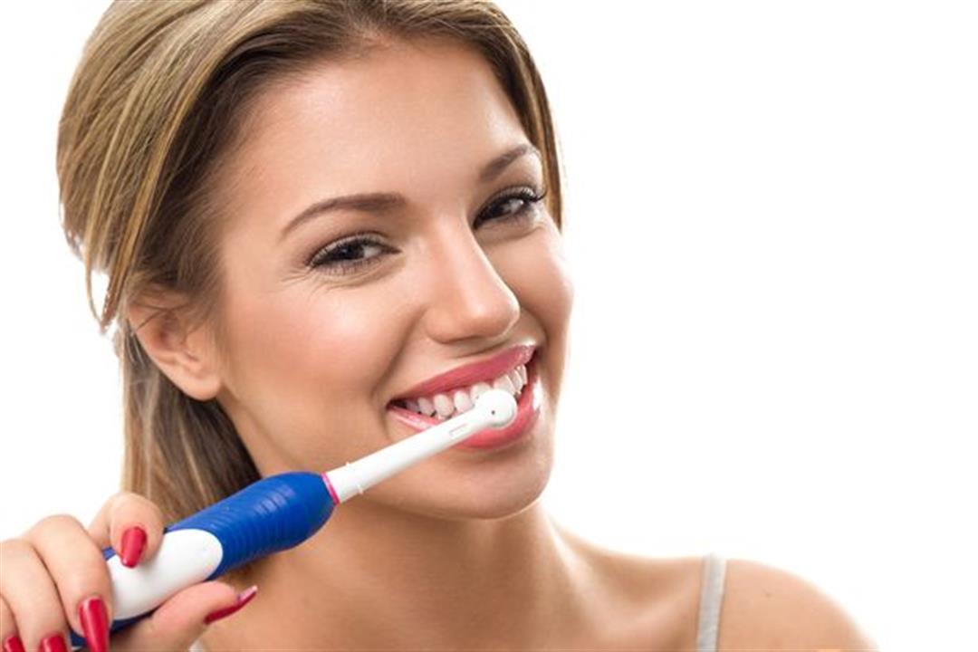 0_PROD-Young-beautiful-woman-brushing-her-healthy-teeth