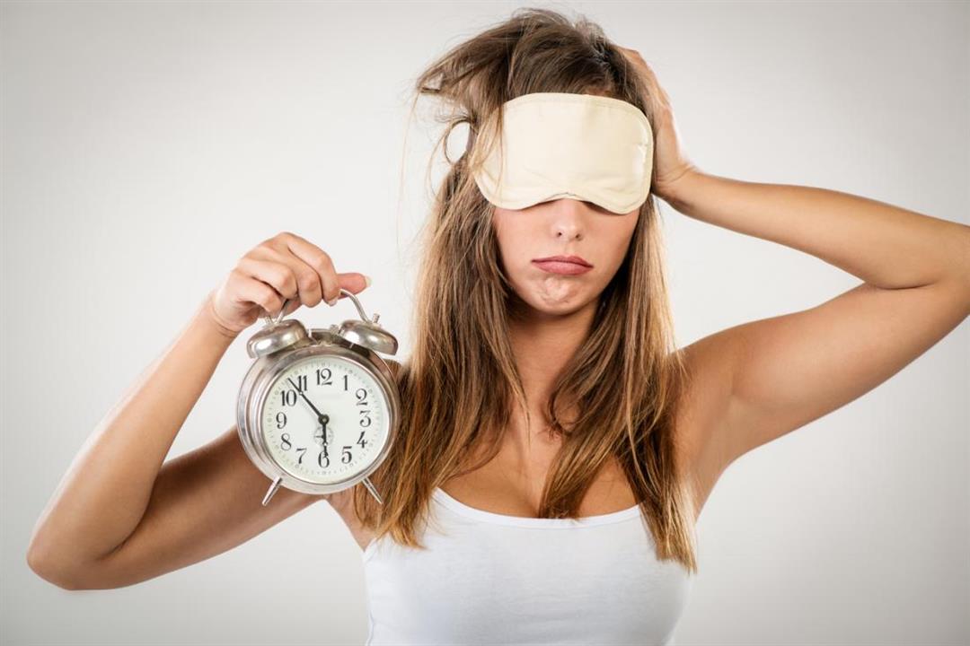 a-woman-woken-by-an-alarm-clock