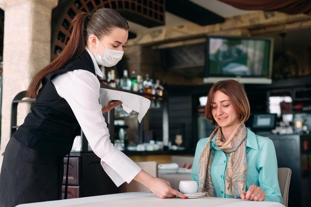 woman-restaurant-waitress-face-mask-indoors-coffee-cafe