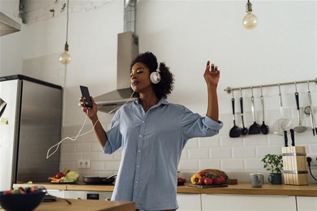 woman-dancing-and-listening-music-in-the-morning-in-royalty-free-image-1584738634