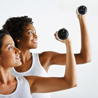 Two Women Exercising With Weights
