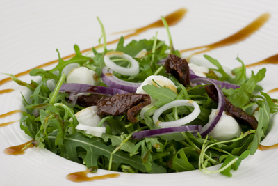 Healthy green salad with dressing