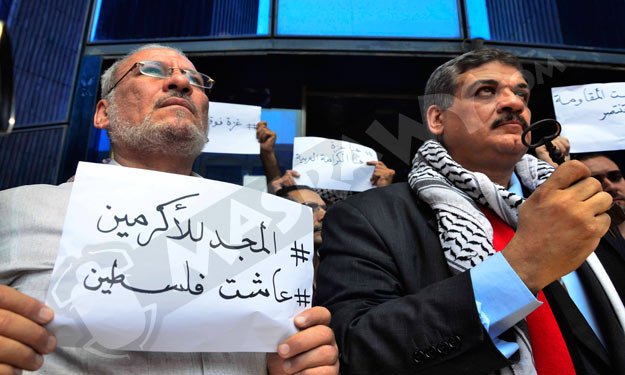بالصور- وقفة احتجاجية للمطالبة بوقف العدوان الإسرائيلي على غزة أمام ''الصحفيين''