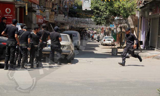 بالصور.. كر وفر و''جثة'' على الرصيف في اشتباكات بين الأمن والإخوان بشارع فصيل