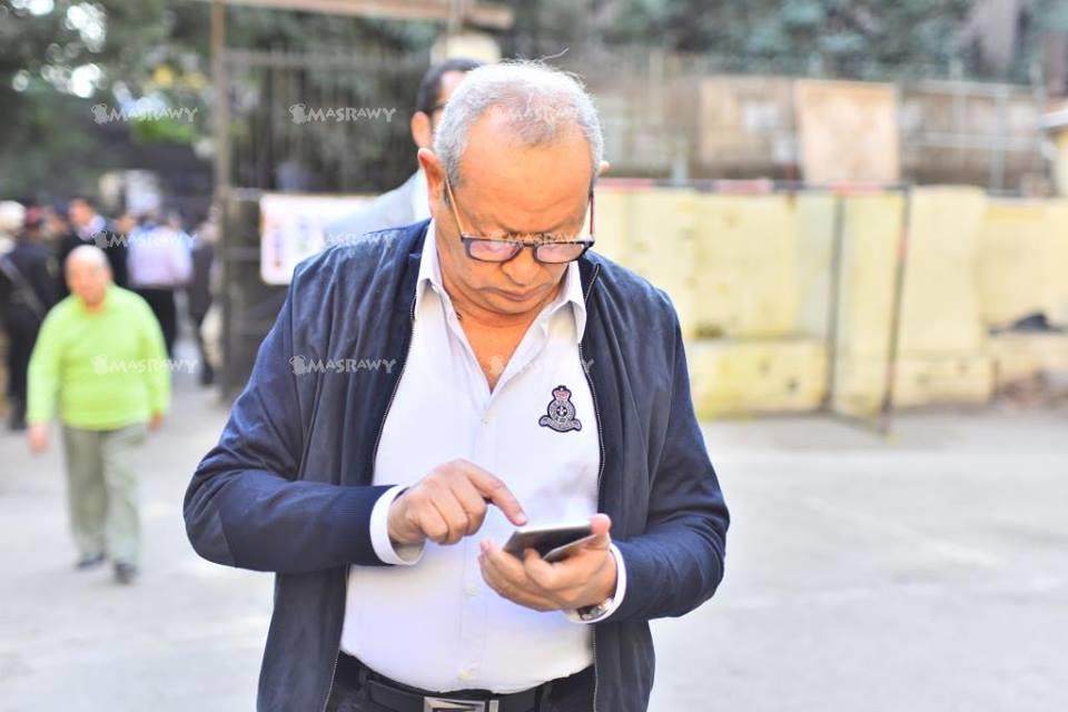 نجيب ساويرس خلال الادلاء بصوته في الانتخابات البرلمانية                                                                                                                                                 