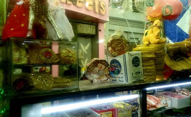 أقباط يبيعون حلوى المولد النبوي في المنيا,,                                                                                                                                                             