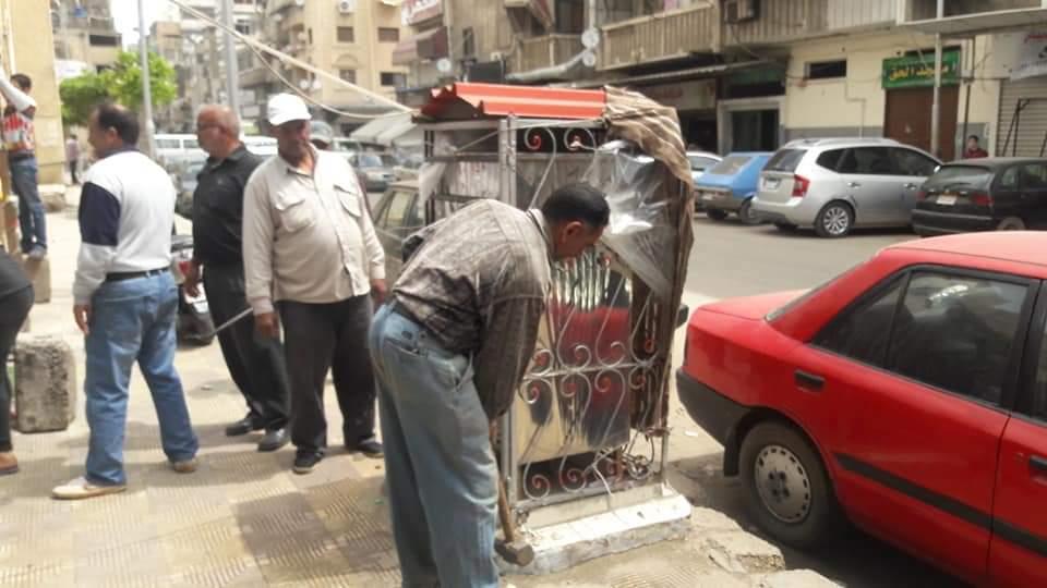 إزالة مبردات المياه من شوارع بورسعيد