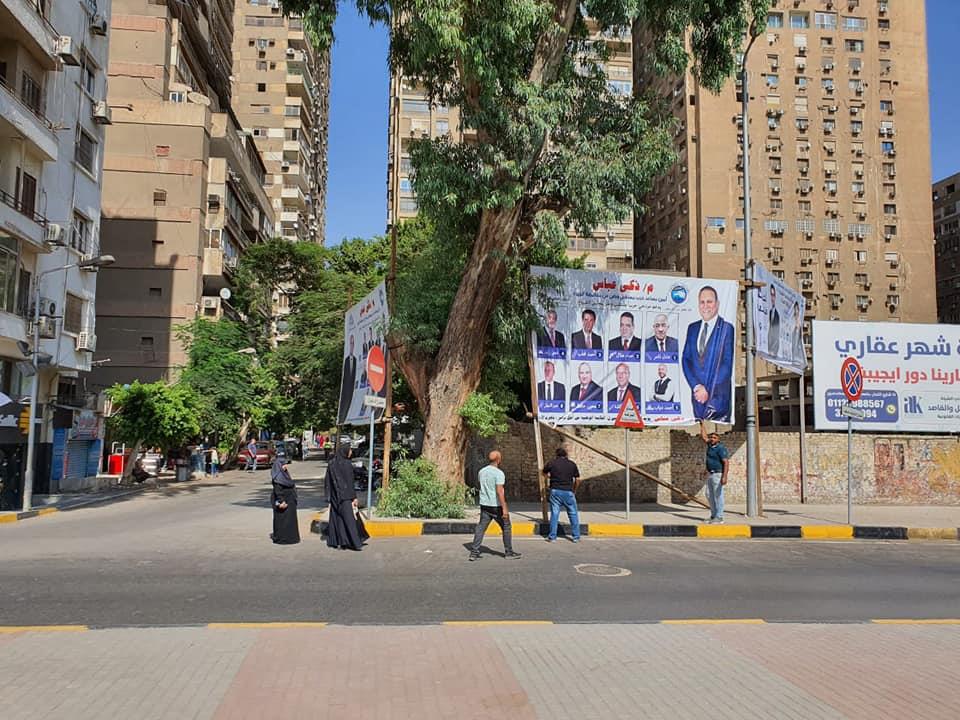 إزالة لافتات انتخابية بدون تصريح من ميدان النهضة ومحيط جامعة القاهرة 