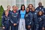 US First Lady Michelle Obama poses with US athlete team members 