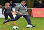 British footballer David Beckham kicks the ball