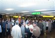بالصور- عودة المصريين العاملين بليبيا إلي مطار القاهرة