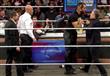  جون ستيوارت يصارع نجم WWE رولينز