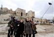 سوريون يلتقطي سيلفي خلف الدمار في حلب                                                                                                                                                                   