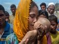 سيدة من الروهينجا وصلت بنجلاديش، حاملة ابنها الرضيع المتوفي يوم 14 سبتمبر                                                                                                                               