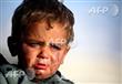 طفل نازح من مدينة الرقة السورية (أف ب)