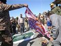 عراقيون يشعلون العلمين الأميركي والسعودي خلال مسير