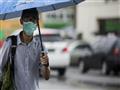 سكان رانغون بدأوا يرتدون اقنعة للوقاية من فيروس انفلونزا الخنازير في 27 تموز/يوليو