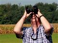 Bob-Cox-from-Evansville-IN-checks-out-his-binoculars-as-he-waits-for-the-beginning-of-the-solar-ec                                                                                                      