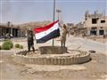 مقاتلون موالون للحكومة السورية يرفعون العلم السوري