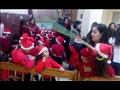بملابس بابا نويل.. أطفال يحتفلون برأس السنة داخل كنائس المنيا
