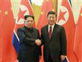 الرئيس الصيني يصافح زعيم كوريا الشمالية