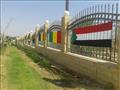 أعلام الدول المشاركة فى أسبوع شباب الجامعات تزين سور جامعة أسوان