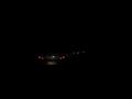 أنوار سيارات تسير في الظلام الحالك في شوارع كراكاس