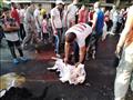 جزارون يرتدون قمصان تحيا مصر خلال ذبح الأضاحي بالإسكندرية (16)