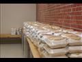 صور من توزيع وجبات على مدن العزل الصحي
