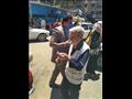 توزيع كمامات في مواقف السيارات والأسواق الشعبية ببورسعيد مجانًا