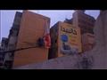 إزالة الإعلانات المخالفة من واجهات المباني في بورسعيد
