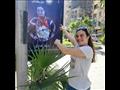 احتفاء بطلة السباحة دينا طارق بصورتها في الشارع