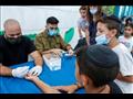 أطفال إسرائيليون يجرون الفحص السريع لكشف كوفيد-19