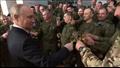 الرئيس بوتين في صورة احتفالية مع عسكريين روس، بعد 