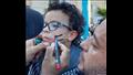 طفل مصري بالإسكندرية يزين وجهه بعلم فلسطين