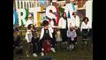 أطفال يعزفون بشوارع بورسعيد لتنشيط السياحة (5)