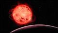 تصور فني للنجم القزم الأحمر TRAPPIST-1 والكوكب TRAPPIST-1 b في المقدمة 