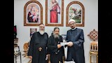 أسقف السويس ومدير الدعوة عقب شراء الصكوك