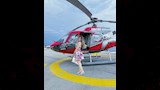 ميرنا جميل بجوار طائرة هليوكوبتر
