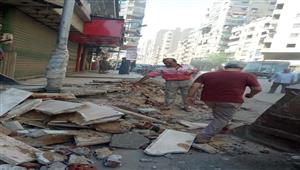 الجيزة: إزالة التعديات على الطريق العام بشارع العشرين