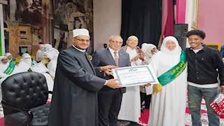 أسوان تُكرم 41 سيدة من خاتمات القرآن الكريم -صور
