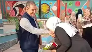 قبلت يد زوجها وجبينه في طابور الصباح.. هل تستحق مُعلمة الشرقية العقاب؟ (صور)