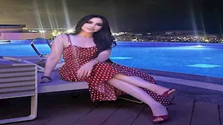 5 صور لزوجة محمد عواد رفقة المدير الفني الأسبق للزمالك جورفان فييرا