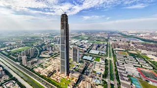 17 صورة لأطول برج مهجور في الصين بعد أنباء استئناف البناء