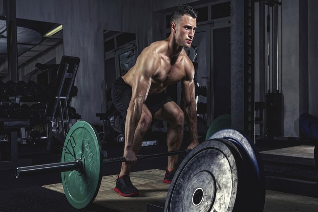man-performing-deadlift-in-gym