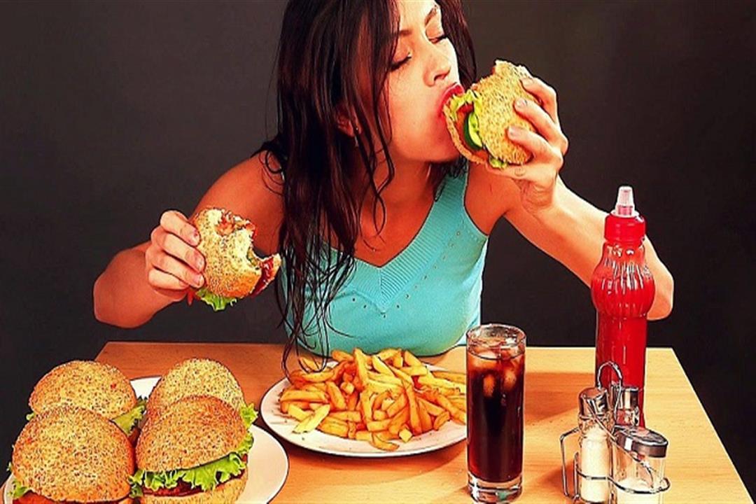 stock-footage-woman-eating-fast-food-time-lapse1-e1479904734596