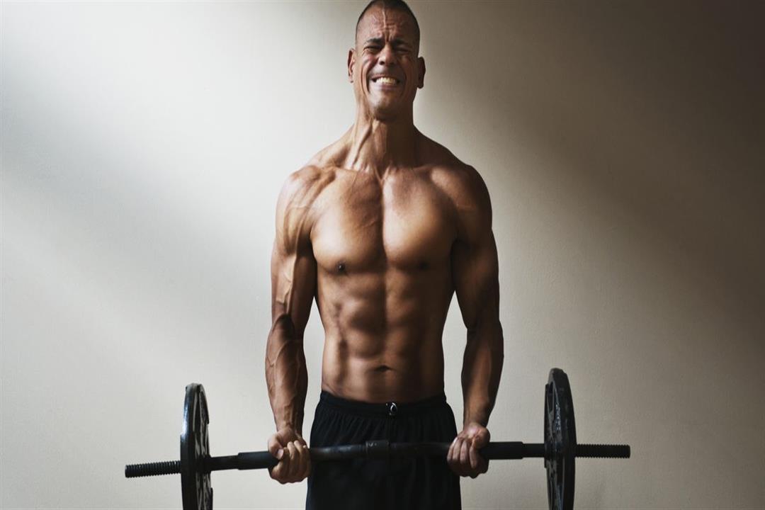 hispanic-athlete-lifting-weights-royalty-free-image-606353871-1548458585