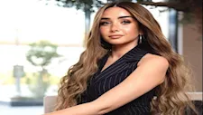 أناقـة ناعمة.. هنا الزاهد تتألق بسوت أبيض وكعب أسود- سر اللوك