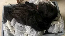 بالصور- تفاصيل أغرب محاولة تهريب 12 كيلو خُصل شعر طبيعي بمطار الإسكندرية