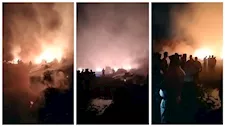 الدفع بـ12 سيارة إطفاء للسيطرة على حريق بأراضٍ زراعية في الفيوم - صور